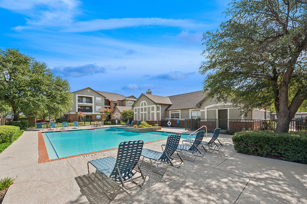 Swimming pool with sundeck at Valley Trails Apartments in Irving TX